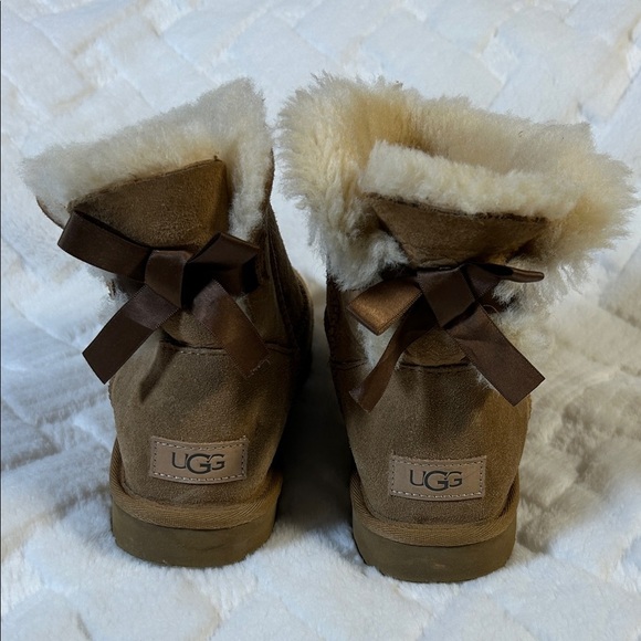 UGG Shoes - UGG Tan Shearling Boots with Ribbon Accents size 7